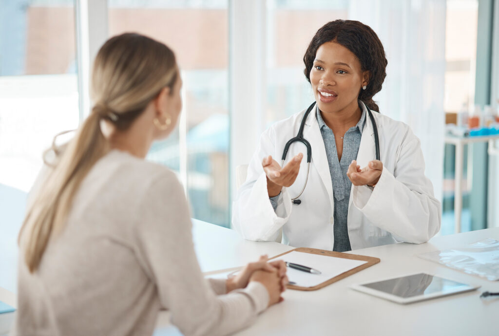 Doctor appointment, consulting and talking with patient about their test results at the hospital. GP, healthcare worker or medical specialist discussing process of procedure or treatment plan.