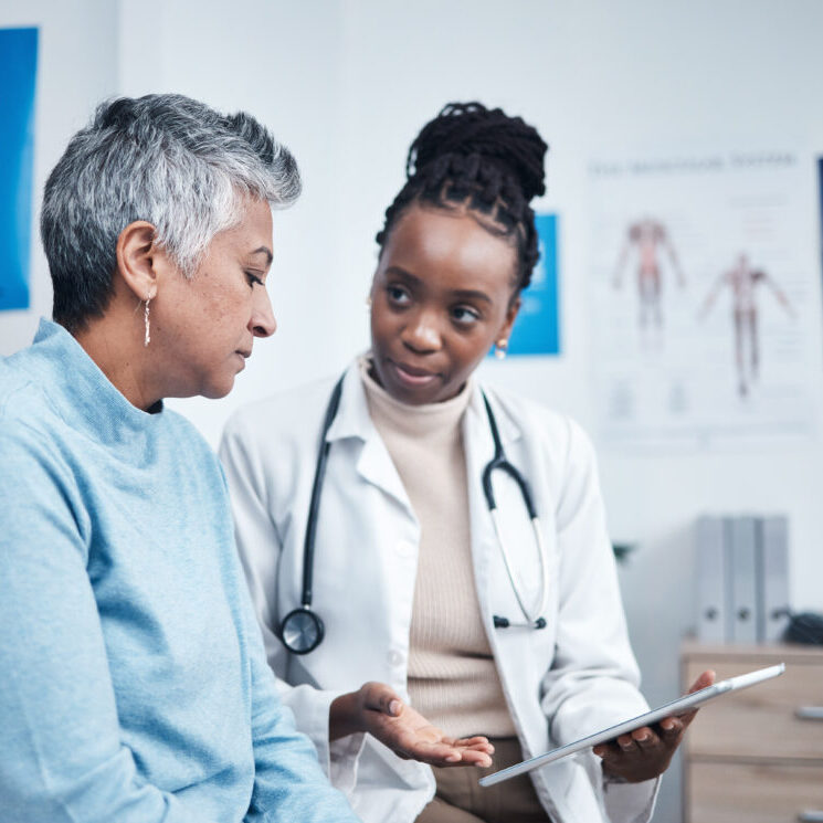 Black woman, doctor and senior patient with tablet, results and listen for health planning, advice or cancer. African medic, mobile touchscreen and healthcare with trust, tech and support in hospital.